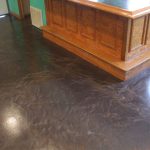 A basement with a metallic epoxy floor.