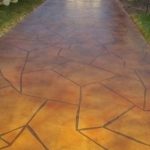 A decorative concrete walkway with an epoxy coating.